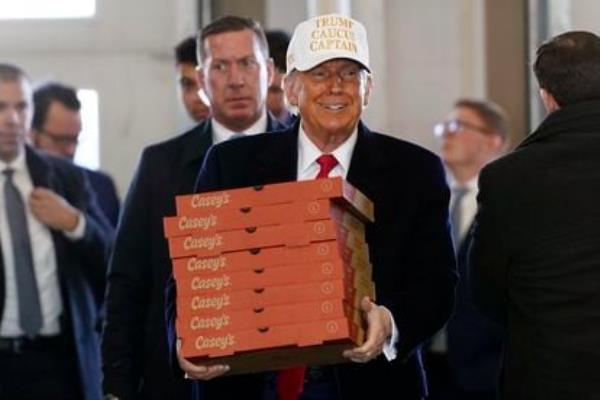 Republican presidential candidate former president Do<em></em>nald Trump arrives to deliver pizza to fire fighters at Waukee Fire Department in Waukee, Iowa, Sunday, Jan. 14, 2024. 